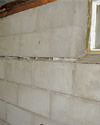 Severely buckling foundation walls in a home in Paducah in need of repairs.