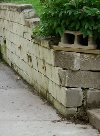 collapsing retaining wall with severe damage in Murray
