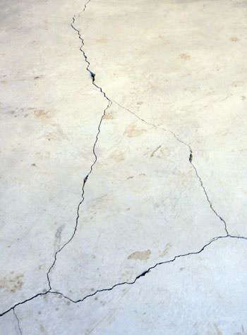 severely cracked, heaving slab floors in a home in Dickson
