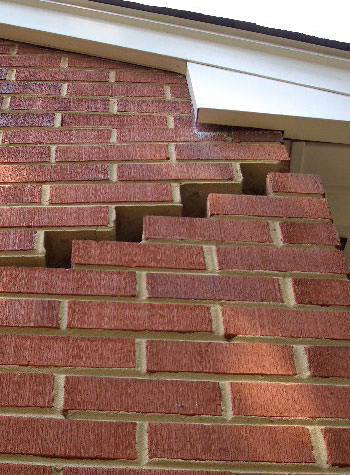 photo of a rotating foundation wall with cracks in Lawrenceburg