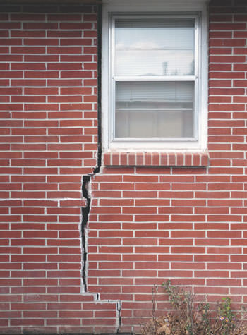 severe foundation wall cracks along a window in Springfield