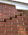 Serious damage to a foundation wall due to settlement of a home in Hermitage