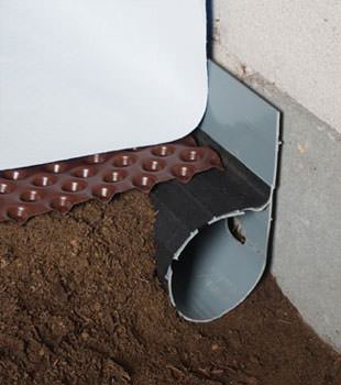 Closeup of a crawl space drainage system installed in Dickson