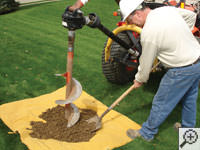 Auguring a hole in the earth for a foundation repair in Shelbyville