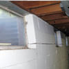 A foundation showing severe inward buckling along the windows in a Cookeville home.