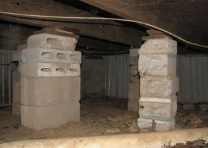 crawl space repairs done with concrete cinder blocks and wood shims in a Paducah home
