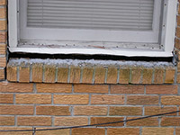 A window sill cracking and separating from the foundation wall in a Lebanon home.
