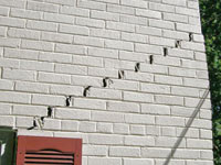 Stair-step cracks showing in a home foundation in Mount Juliet