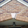 Major tuckpointing on a home archway over a door, with tuckpointing several inches wide that has failed on a Clarksville home