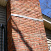A tilting chimney on a Mayfield home with a leaning, tilting chimney that was temporarily repaired.