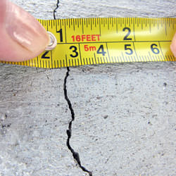A crack in a poured concrete wall that's showing a normal crack during curing in Old Hickory