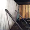 Temporary foundation wall supports stabilizing a Franklin home
