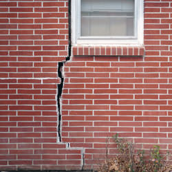 A foundation with a large crack that's wider at the top than on the bottom in Murray