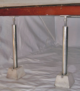 Crawl space jack posts installed in conjunction with a crawl space vapor barrier in Murray
