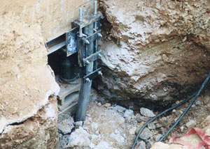a bent, failed foundation push pier installed in Jackson.