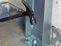 Mounting a foundation channel anchor installation to the floor in Bowling Green.