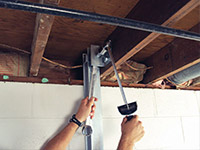 Straightening a foundation wall with the PowerBrace™ i-beam system in a Florence home.