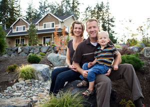 A happy family outside a home with a repaired foundation in Murray