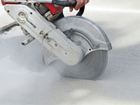 Cutting the driveway for expansion joints during street creep repair in Antioch