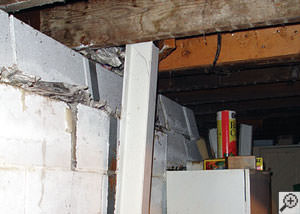 A failing foundation wall and i-beam support in a Clarksville home