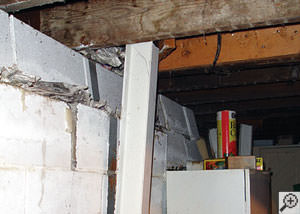 A failing foundation wall and i-beam support in a Nashville home