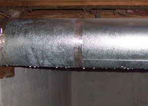 condensation collecting on an HVAC vent in a humid Antioch basement