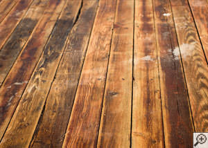 A Columbia wood floor displaying water damage.