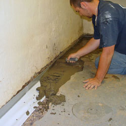 Testing a French drain system in a Hendersonville home.