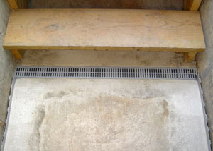 Our grated drain system installed on a leaking basement staircase in Murray.