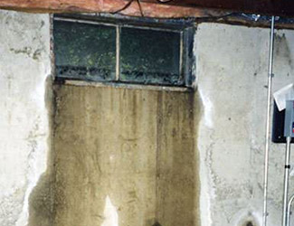 Water pouring out from a basement window in Murfreesboro