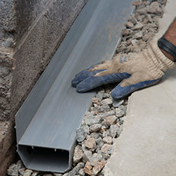 installing a drain tile system in a Brentwood home